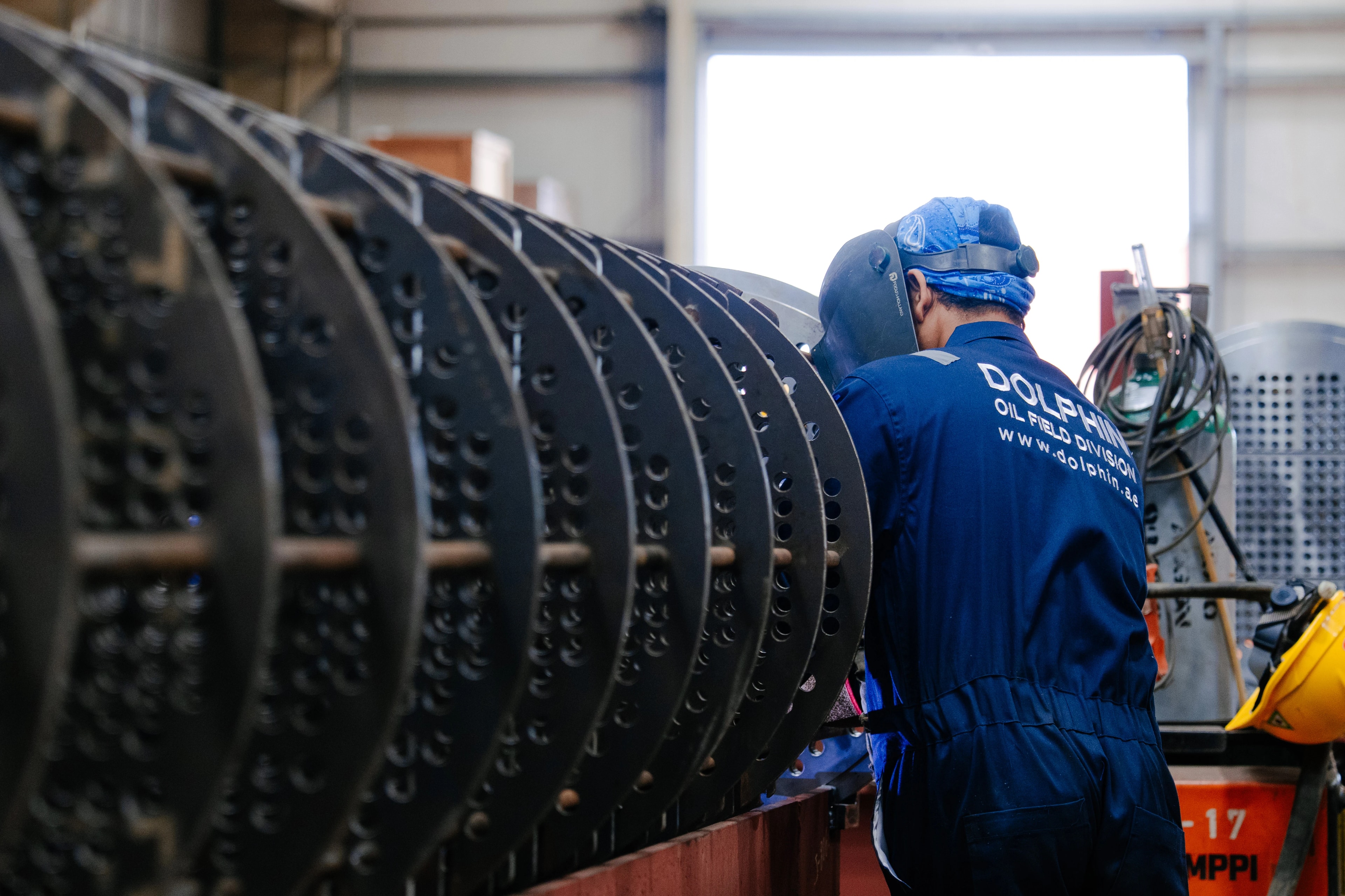 A Dolphin Group technician working beside a heat exchanger tube bundle